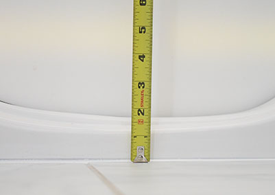 Photo of an open door of a walk-in tub showing a low step-in height