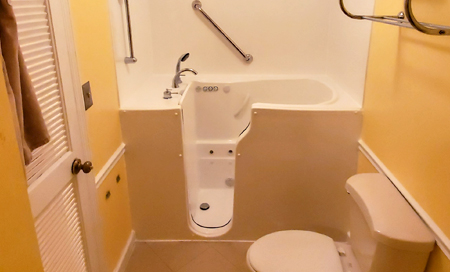 Photo of a walk-in tub in place of where a typical tub and shower would be installed.